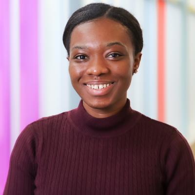 Headshot of Dr Akosua Asare. She has black hair and black eyes.