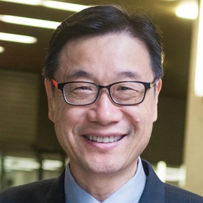 Headshot of Dr Kendall Ho, black hair, black eyes, black rectangular framed glasses