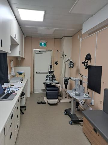 Exam room inside the Eye Van where slit lamp and laser procedures are performed.